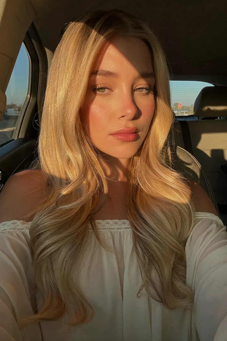 Soft Layered Waves Showcasing Sun-Kissed Platinum Blonde Hair
