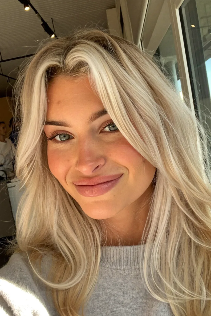 Soft Layered Platinum Blonde Waves with Sun-Kissed Dimension
