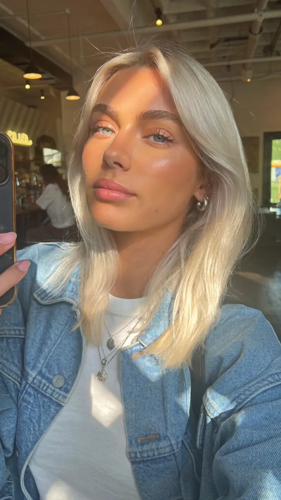 Platinum Blonde Shoulder-Length Hair with Soft Curtain Bangs