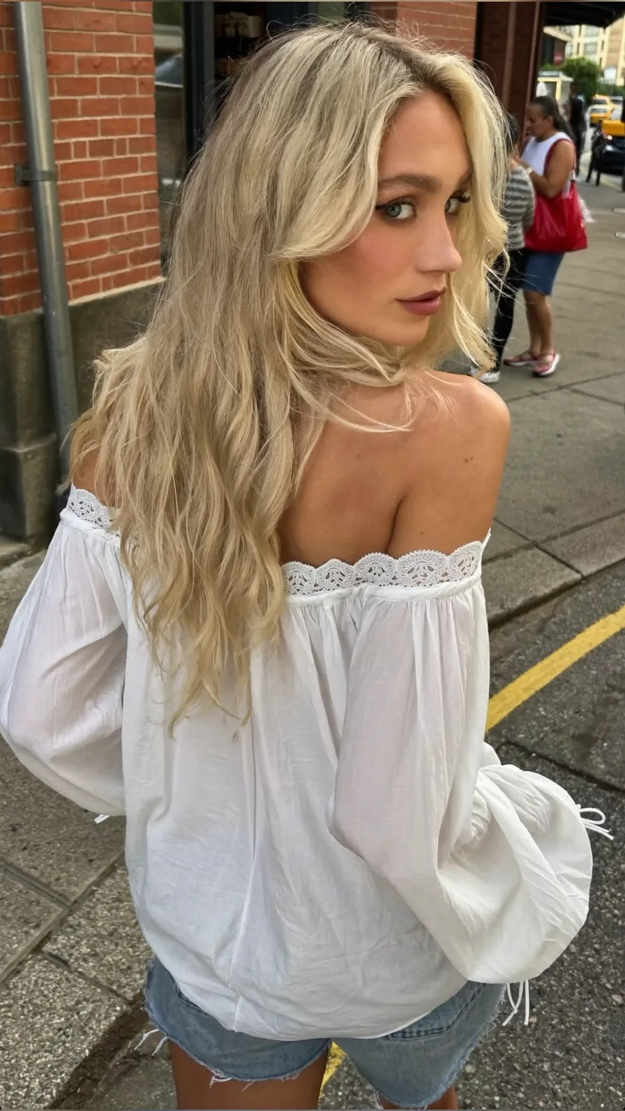 Voluminous Icy Blonde Long Layers with Flowing Curtain Bangs