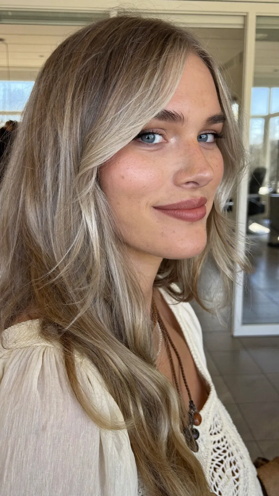 Soft Ash Blonde Long Layers with Flowing Curtain Bangs