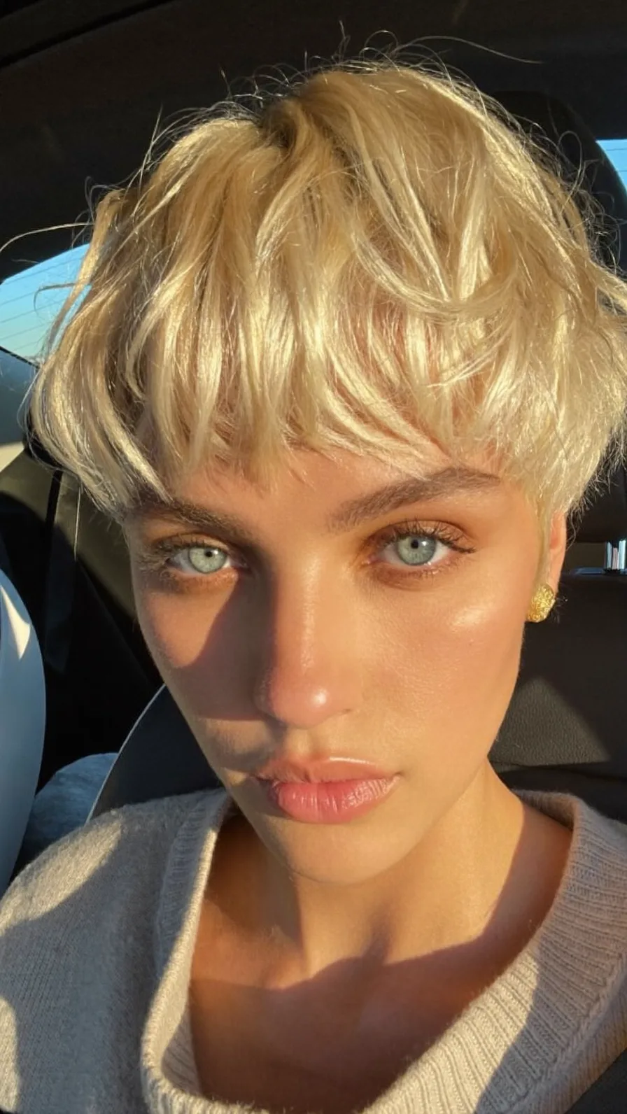 Textured Platinum Blonde Pixie with Choppy Curtain Bangs