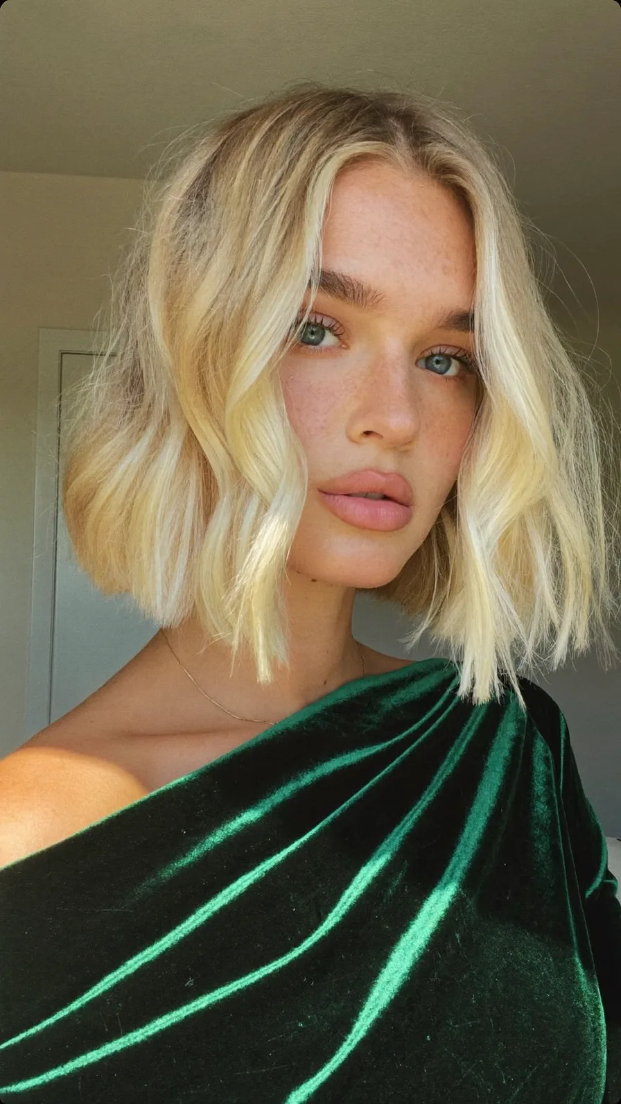 Textured Platinum Blonde Blunt Bob with Curtain Bangs