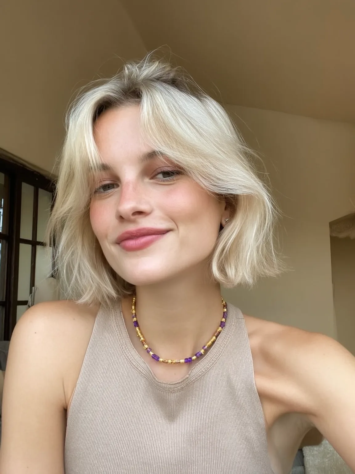 Chin-Length Platinum Blonde Bob with Curtain Bangs