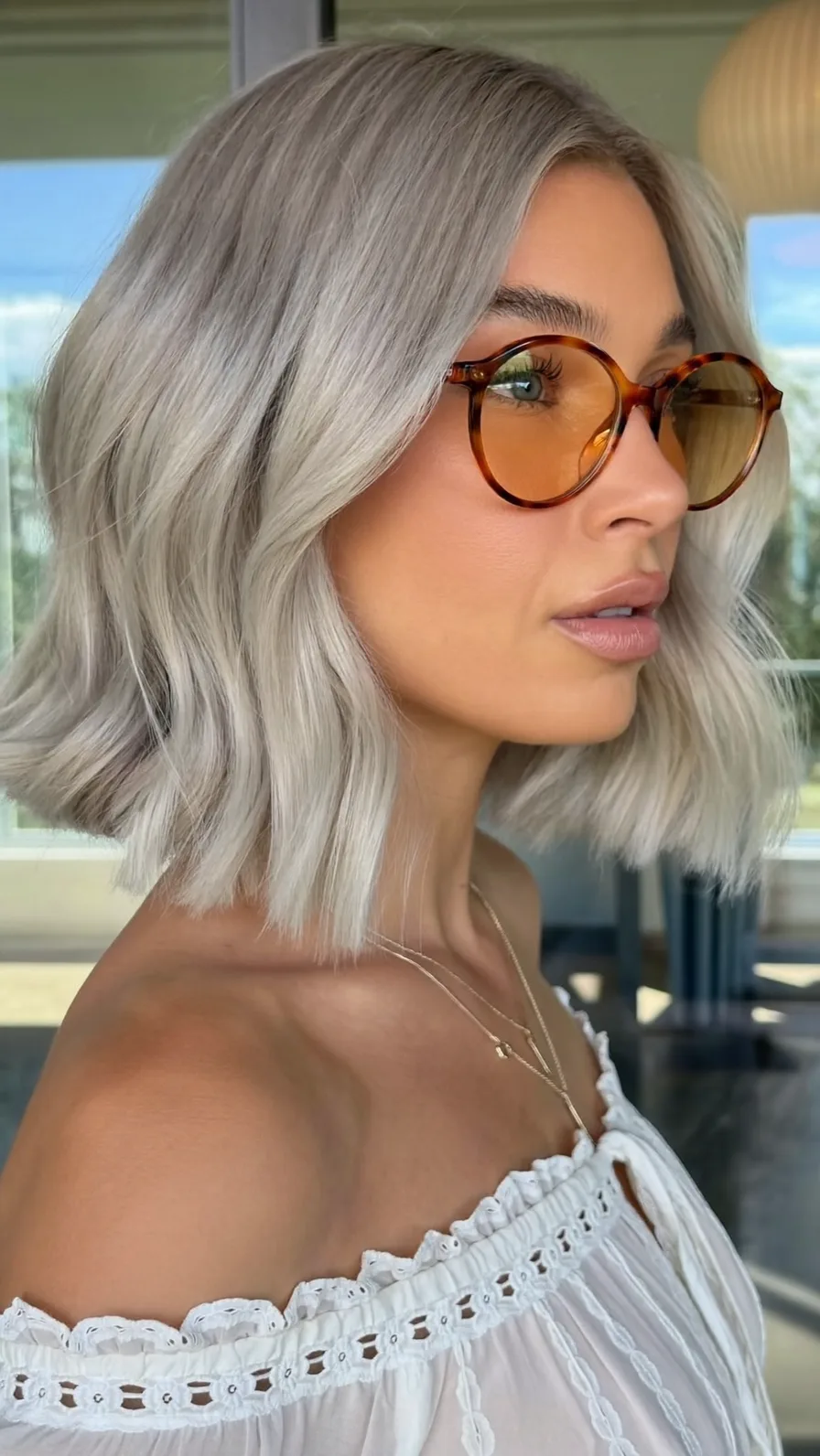 Platinum Ash Blonde Chin-Length Lob with Natural Waves