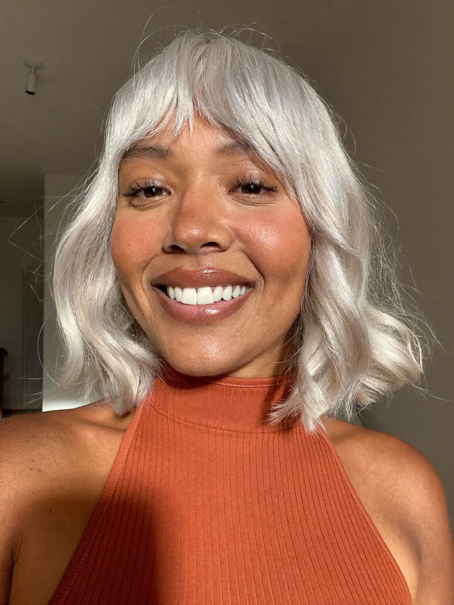 Soft Wavy Platinum Lob with Wispy Bangs for Oval Faces