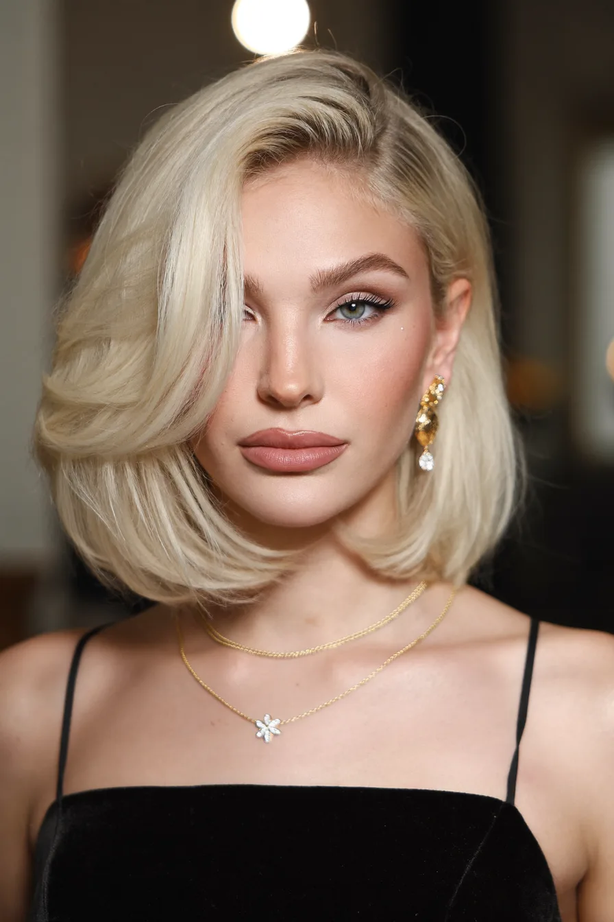 Voluminous Platinum Blonde Lob with Flowing Side Swept Layers