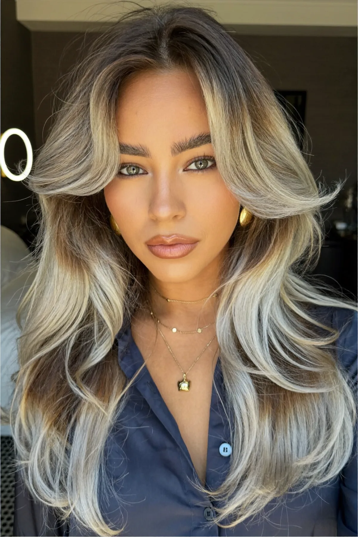 Platinum Ash Blonde Long Layered Waves with Curtain Bangs