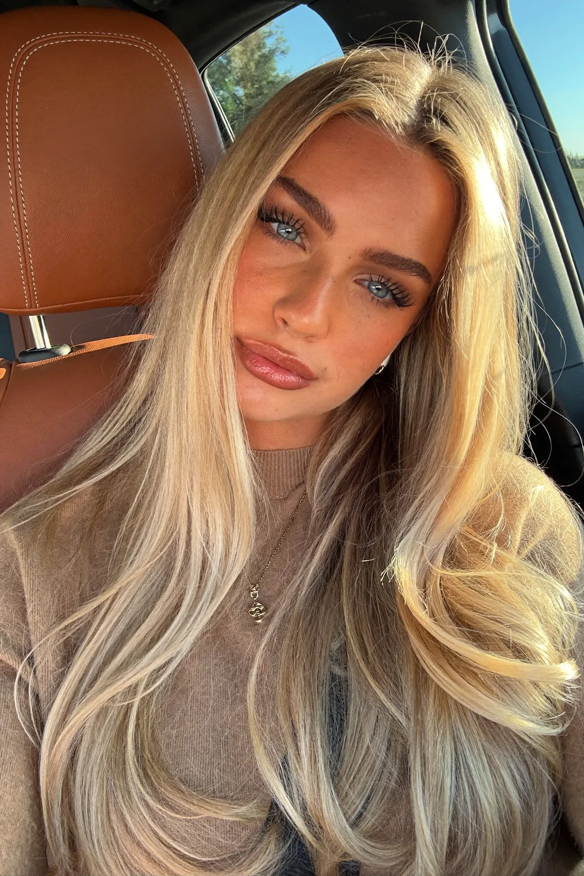 Platinum Ash Blonde Long Layered Cut with Blended Balayage Waves