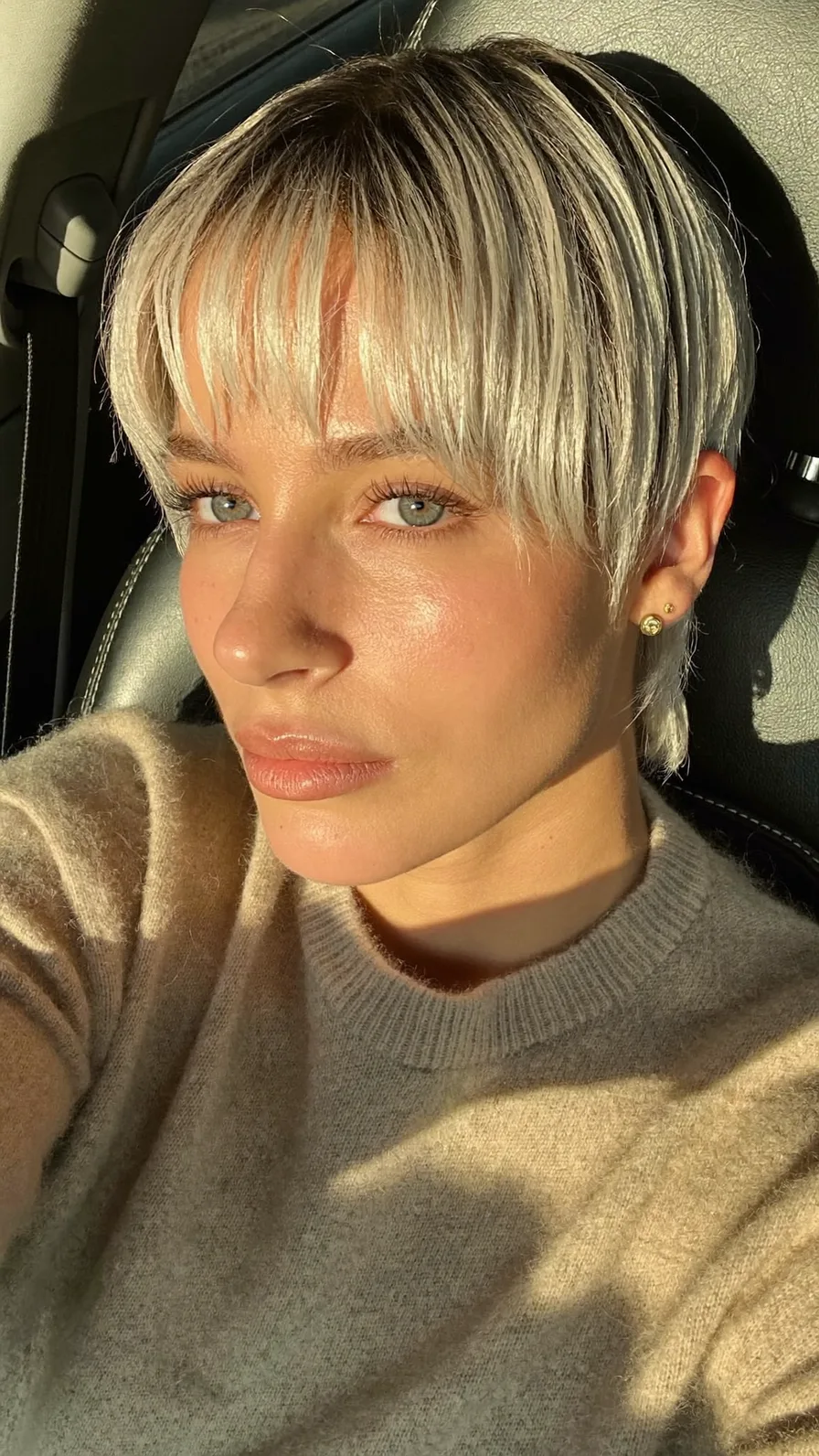 Modern Platinum Blonde Pixie Cut with Textured Curtain Bangs