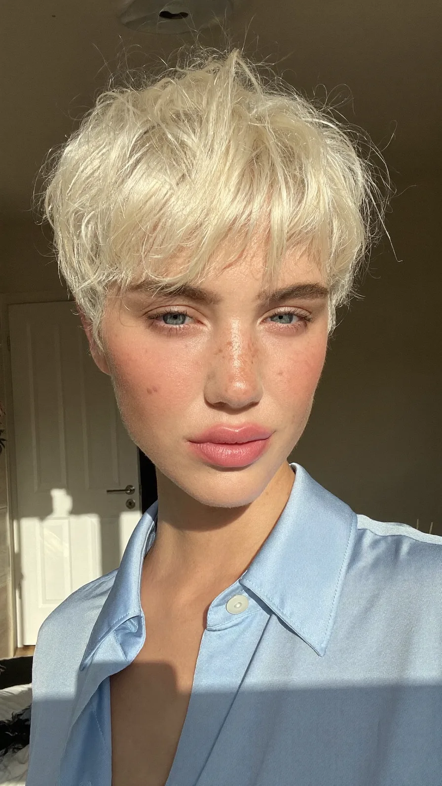 Textured Platinum Blonde Wispy Pixie with Choppy Layers