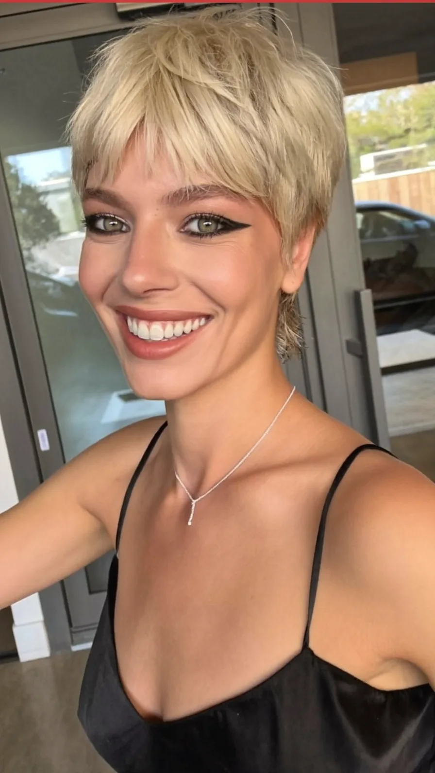 Textured Platinum Blonde Pixie Cut with Micro Bangs
