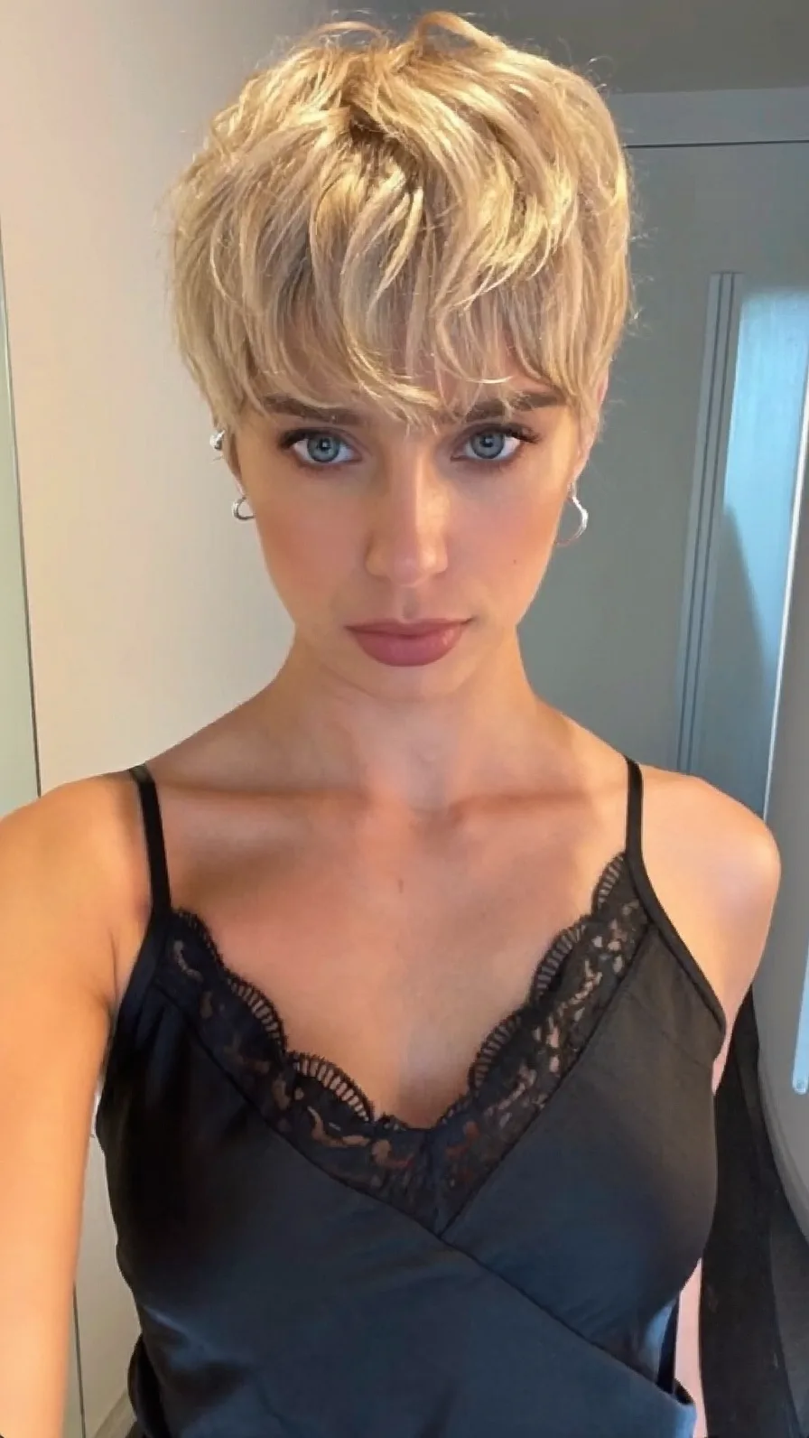 Voluminous Textured Platinum Blonde Wispy Pixie Cut