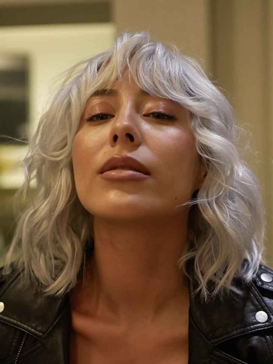 Textured Platinum Shag with Curtain Bangs and Choppy Layers
