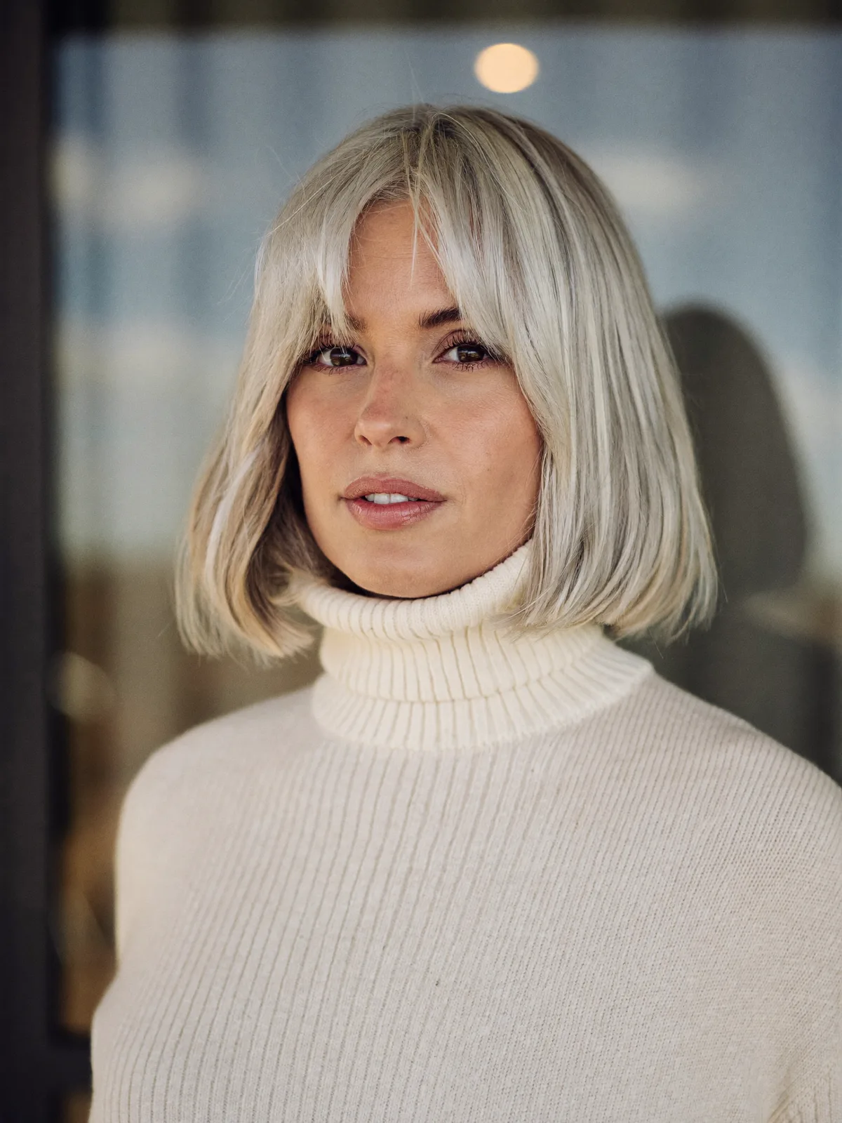 Chic Platinum Silver Bob with Soft Curtain Bangs for Modern Elegance