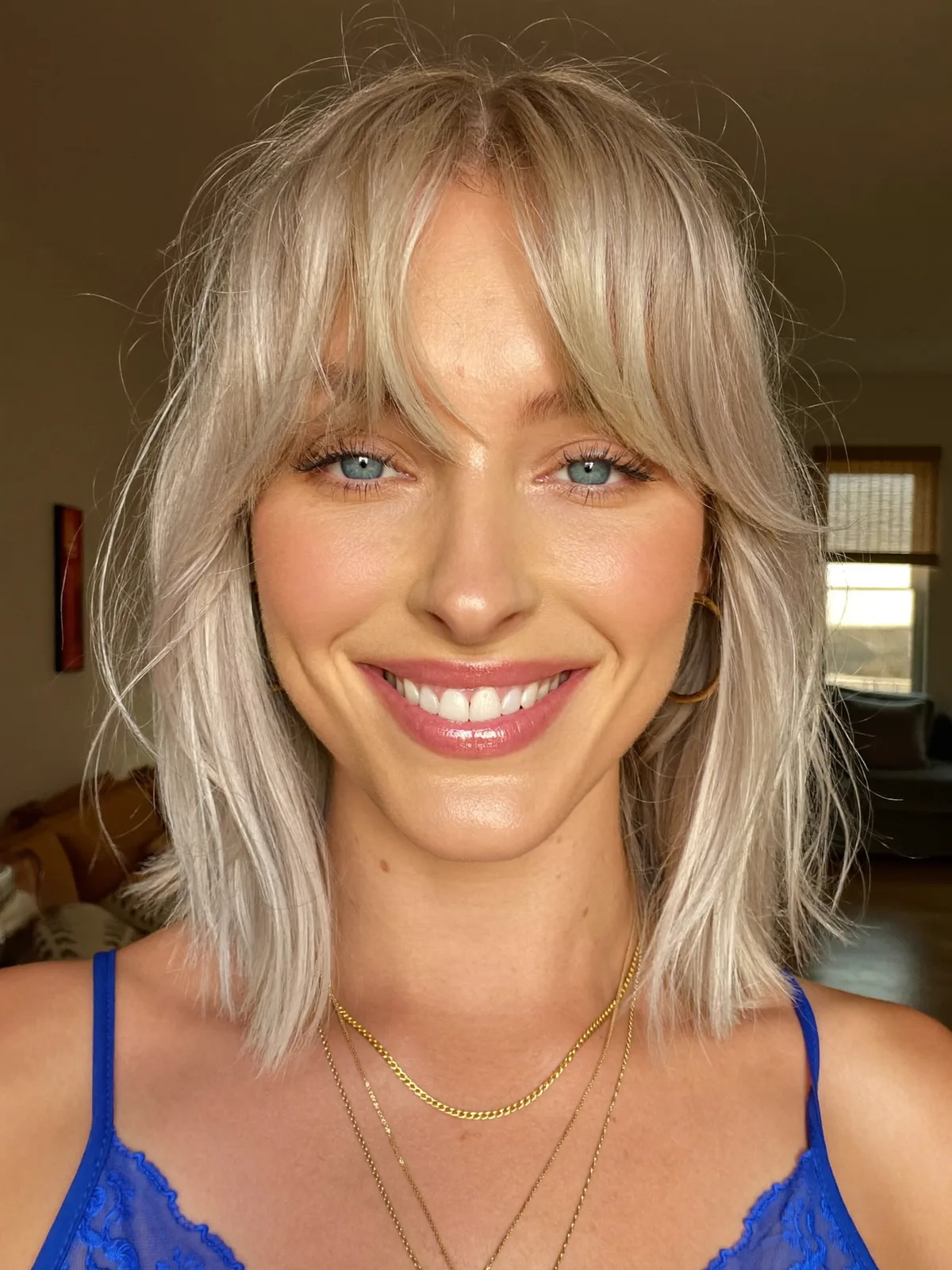 Modern Platinum Silver Layers with Soft Curtain Bangs