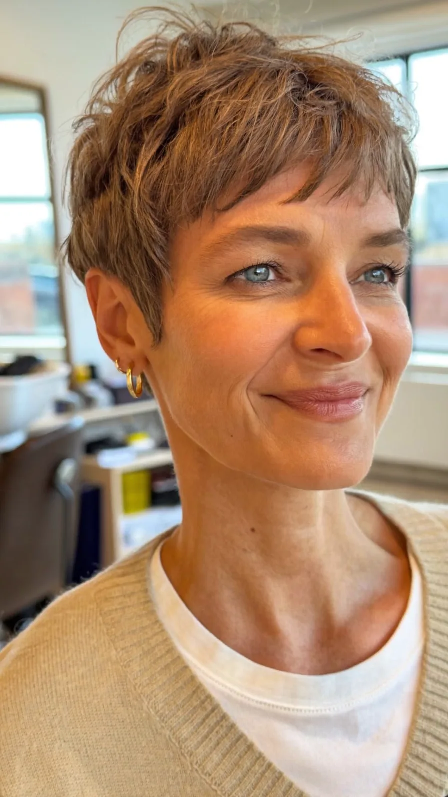 Voluminous Textured Pixie Cut with Micro Bangs and Choppy Layers