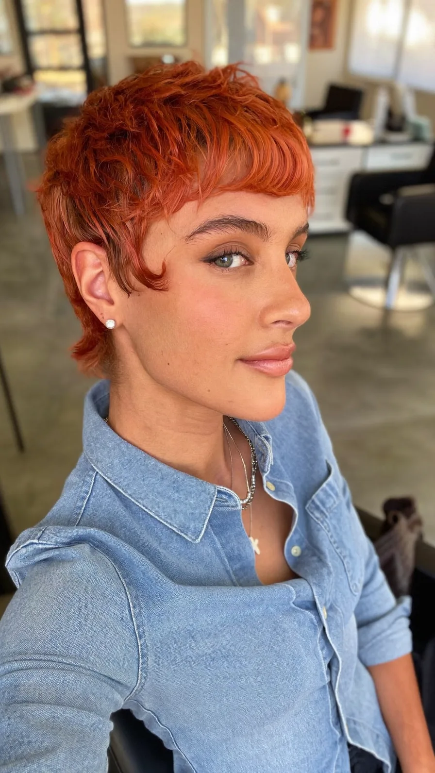Vibrant Textured Pixie Cut with Bold Blunt Bangs