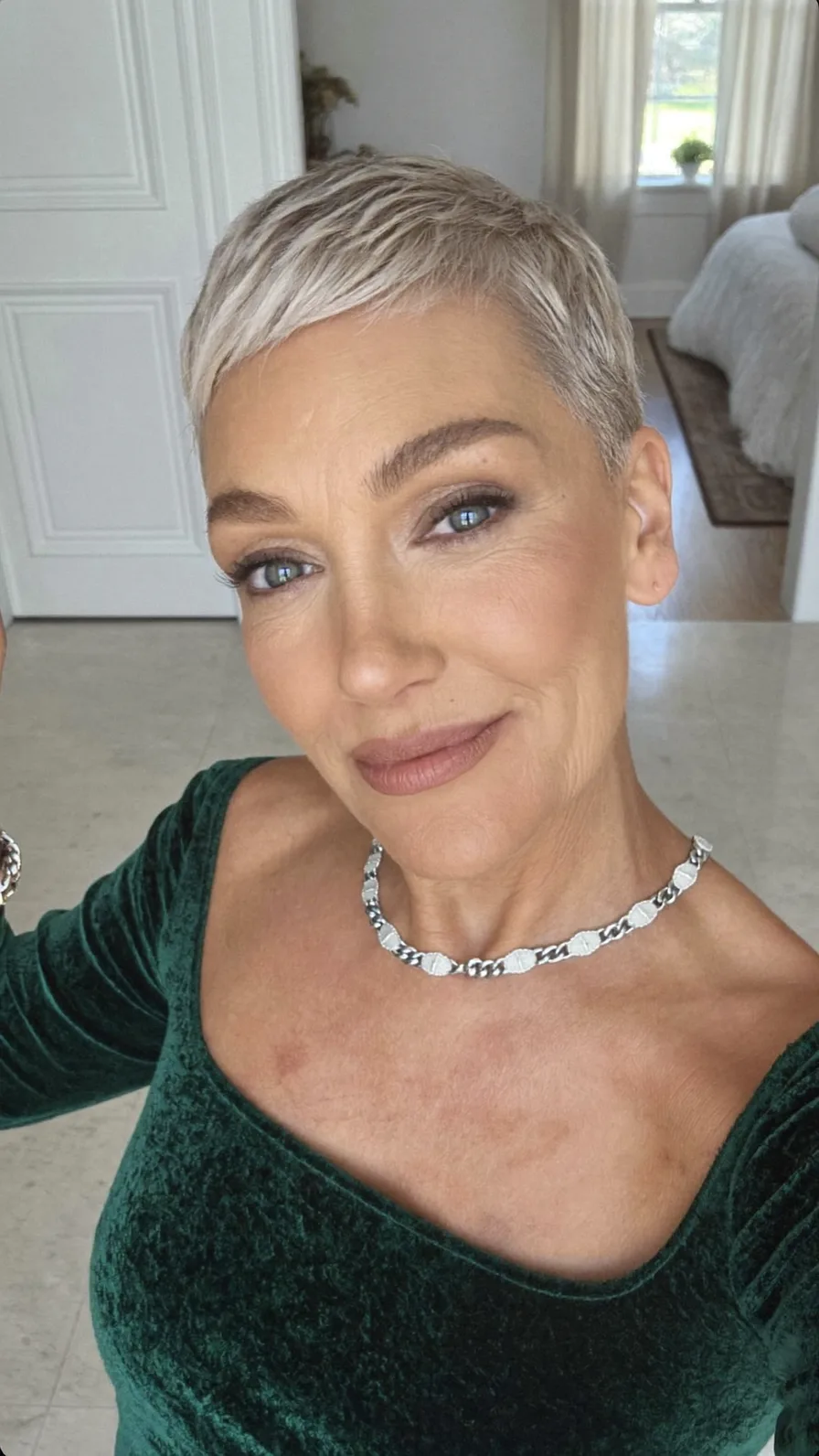 Textured Cool Platinum Blonde Pixie with Side-Swept Bangs