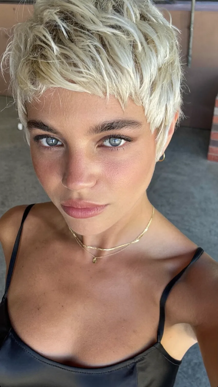 Textured Razor-Cut Platinum Blonde Pixie with Micro Bangs