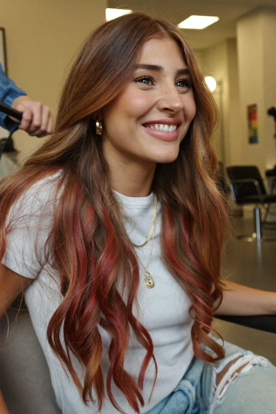 Modern Long Layered Waves with Red Balayage Highlights