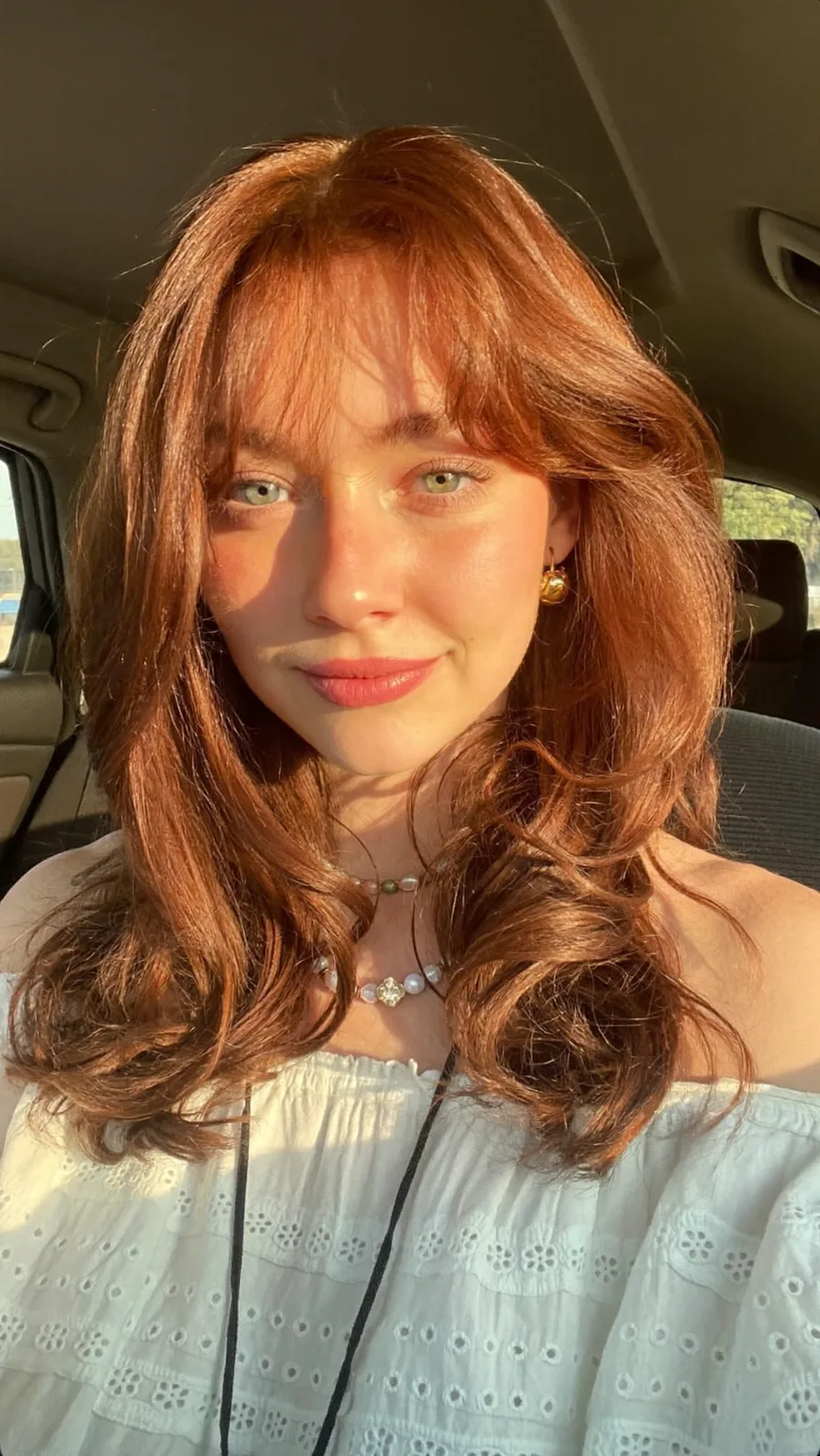 Voluminous Copper Red Long Layers with Curtain Bangs