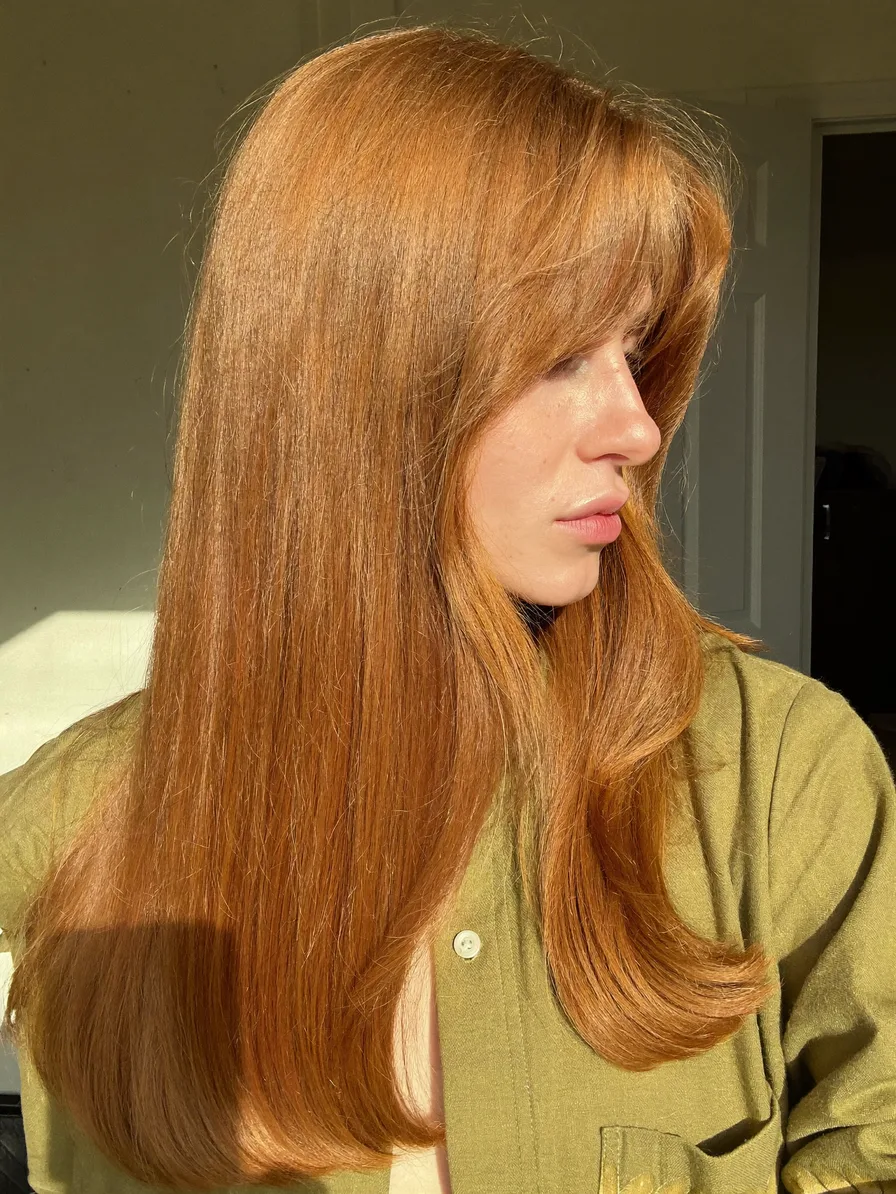 Sleek Long Layers with Soft Curtain Bangs and Rounded Ends
