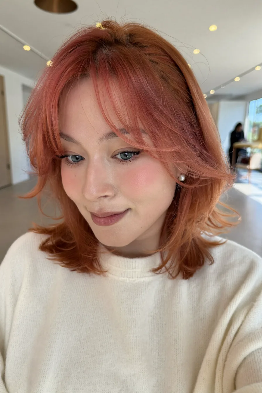 Shoulder-Length Layered Hair with Center Curtain Bangs