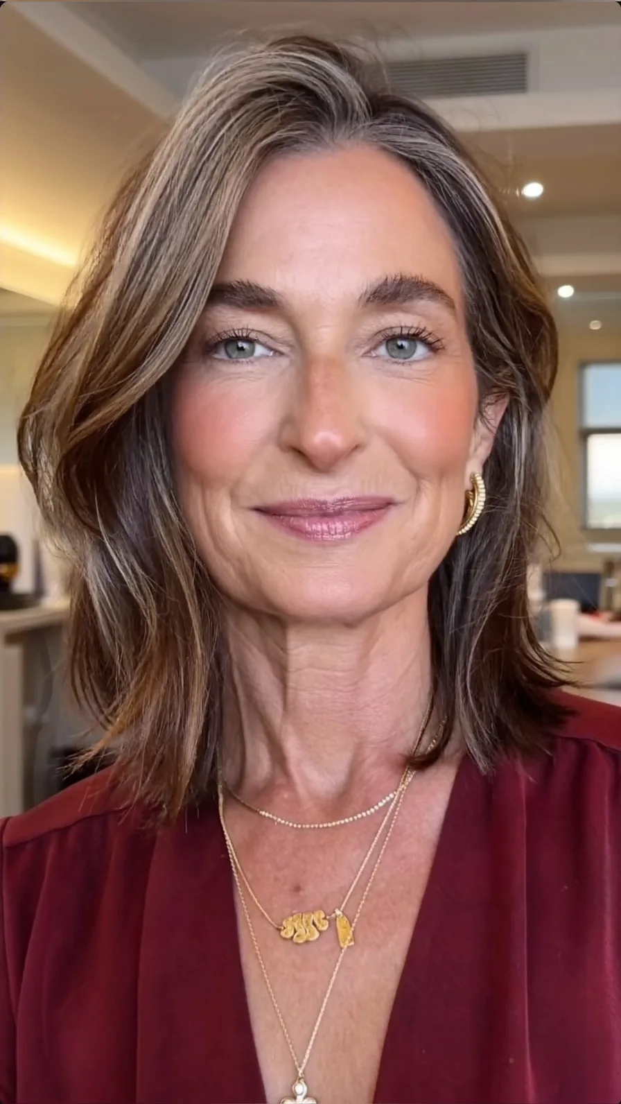Elegant Shoulder-Length Salt and Pepper Wavy Layers with Side Part