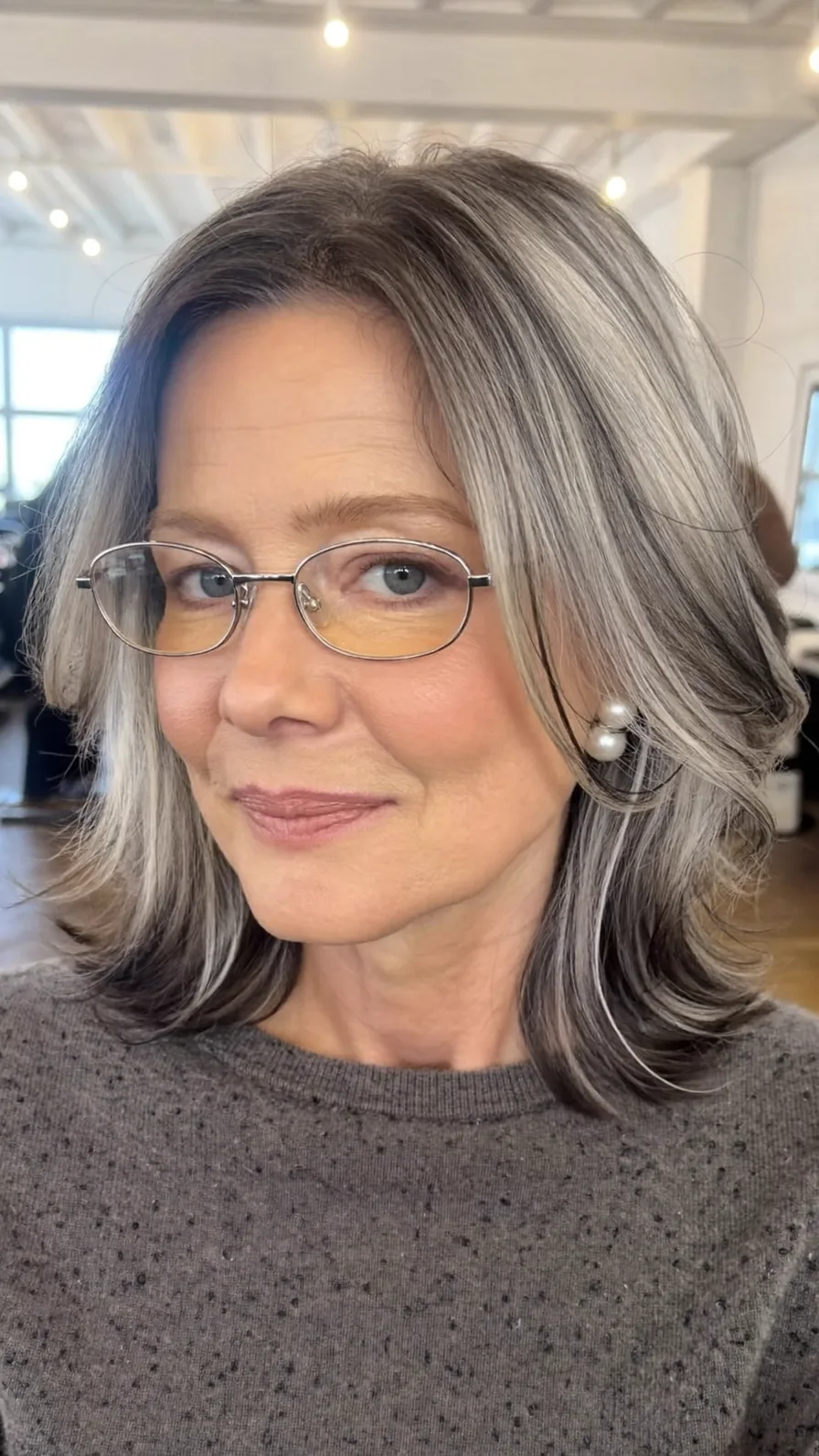 Medium-Length Salt and Pepper Layers with Feathered Ends
