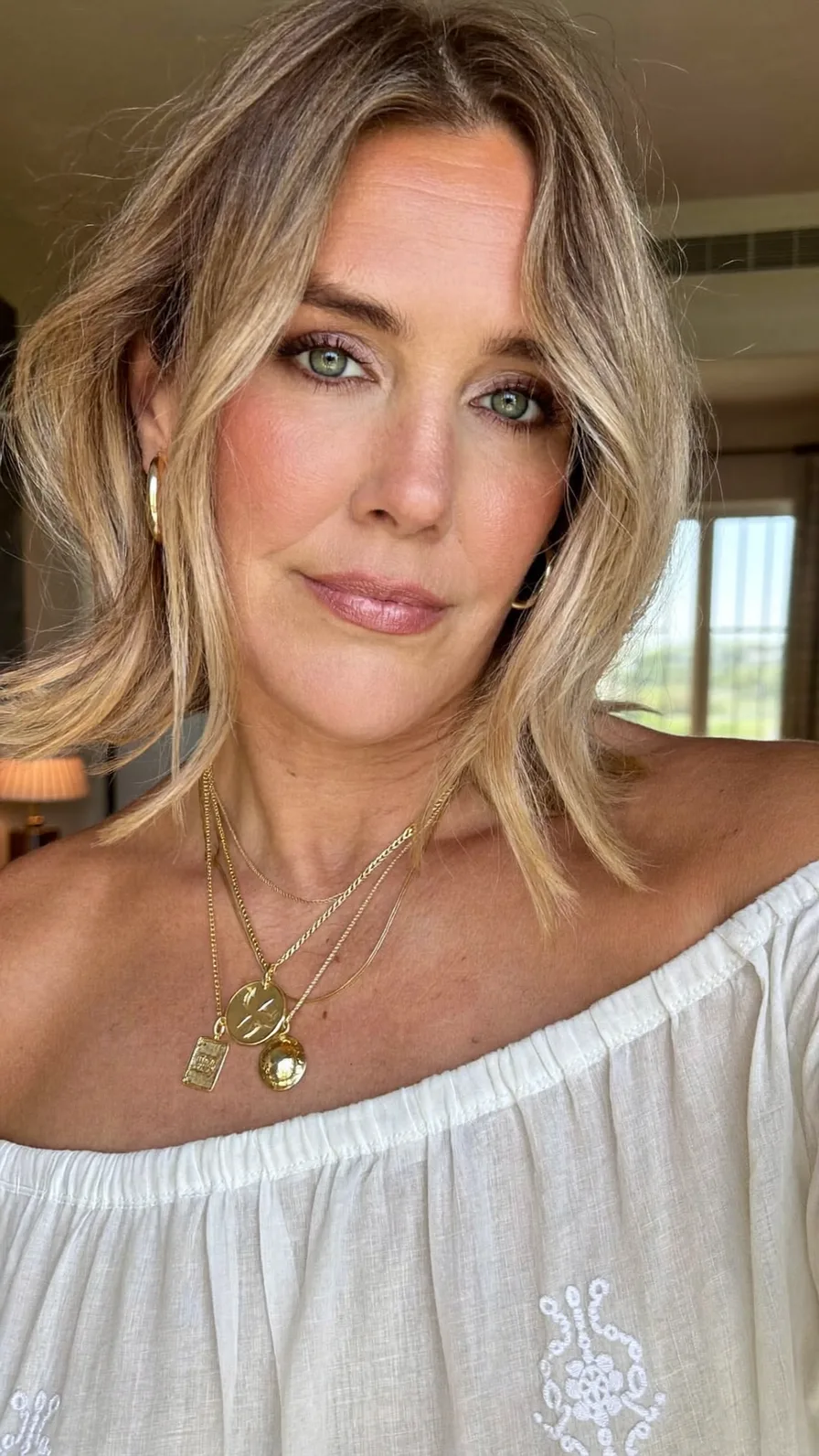 Modern Shoulder-Length Sandy Blonde Hair with Curtain Bangs