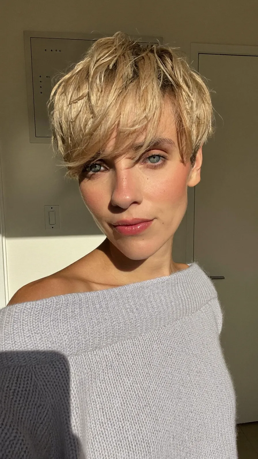 Modern Textured Pixie Cut with Voluminous Side-Swept Bangs