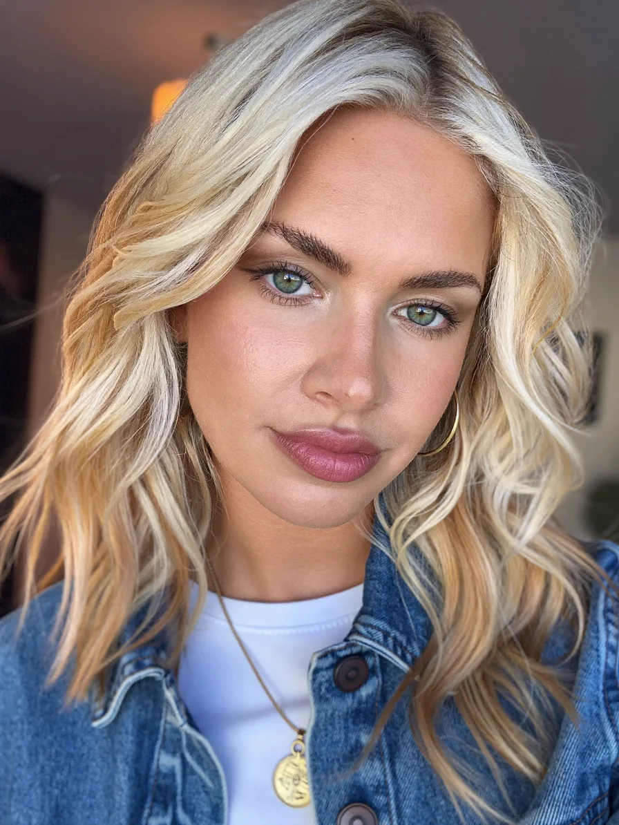 Modern Shoulder-Length Blonde Waves with Feathered Long Layers