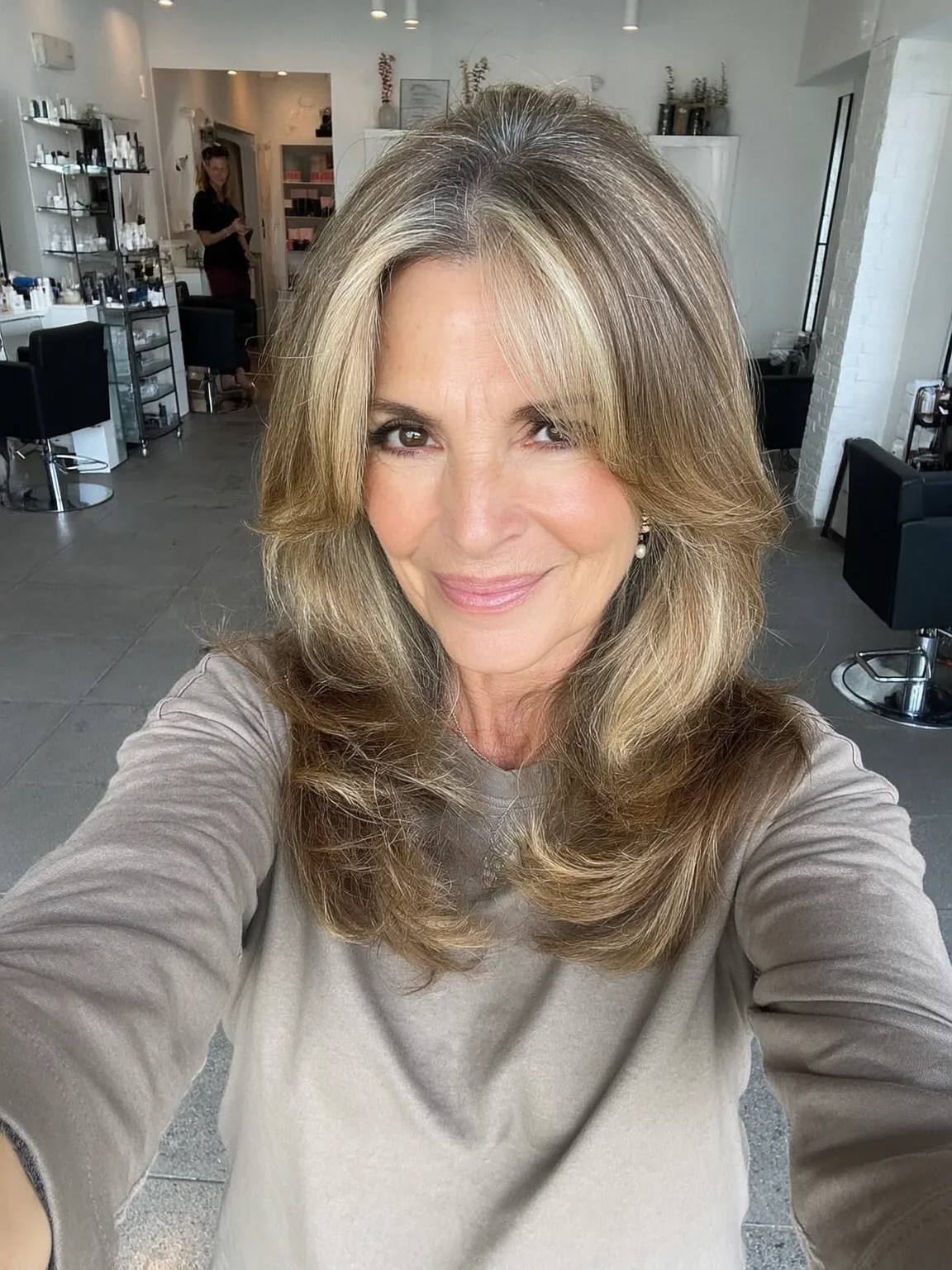 Long Sandy Blonde Waves with Curtain Bangs