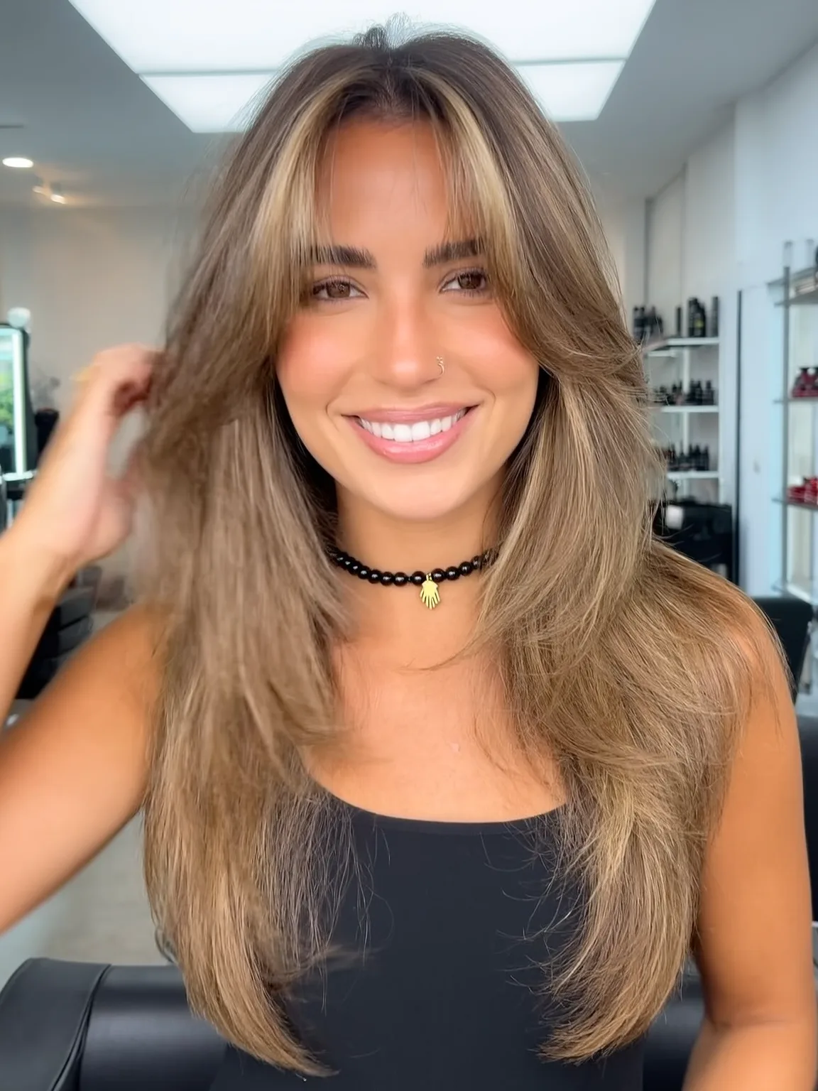 Long Layered Cut with Soft Curtain Bangs in Sandy Blonde