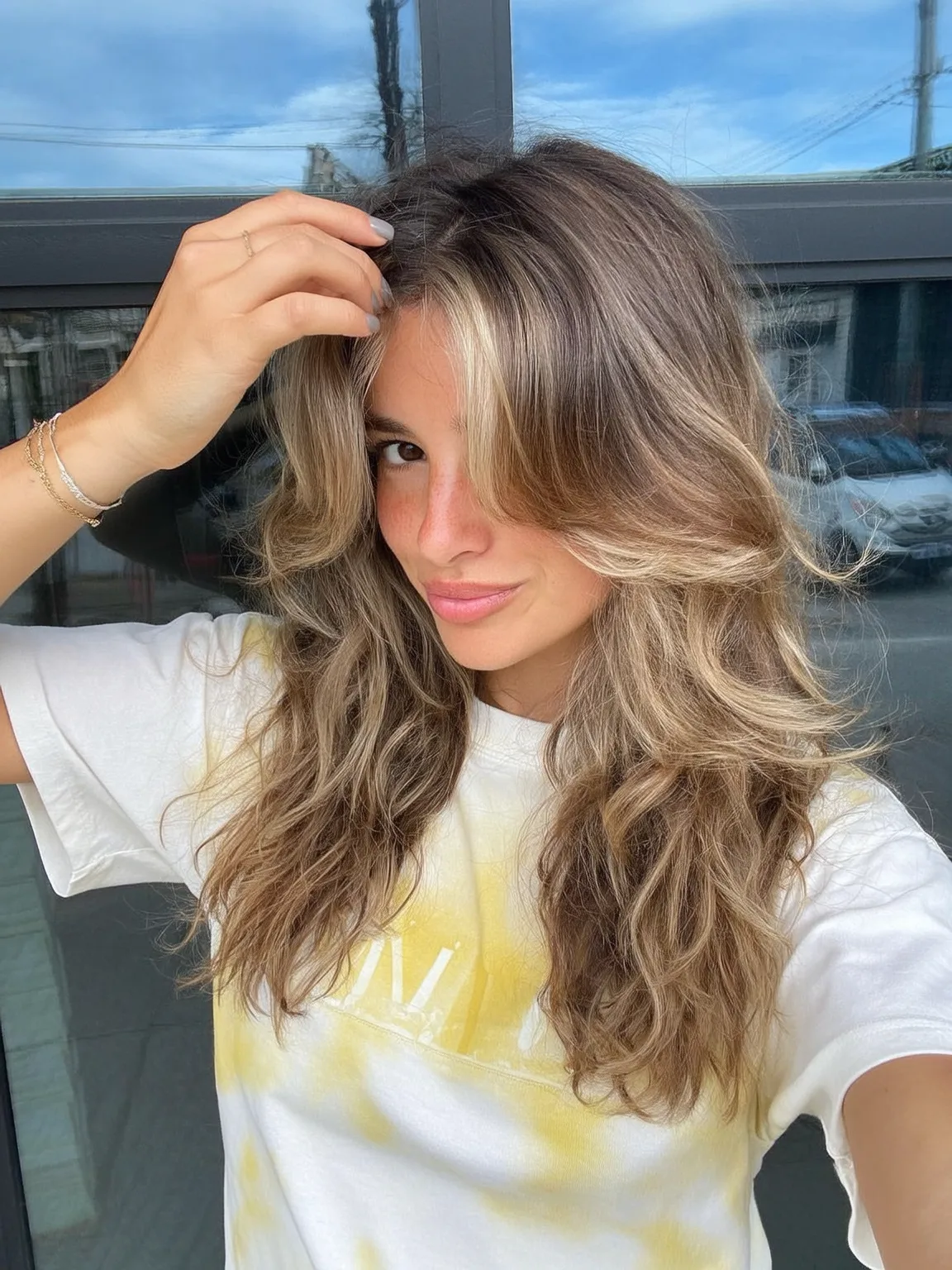 Long Layered Waves with Sandy Blonde Balayage