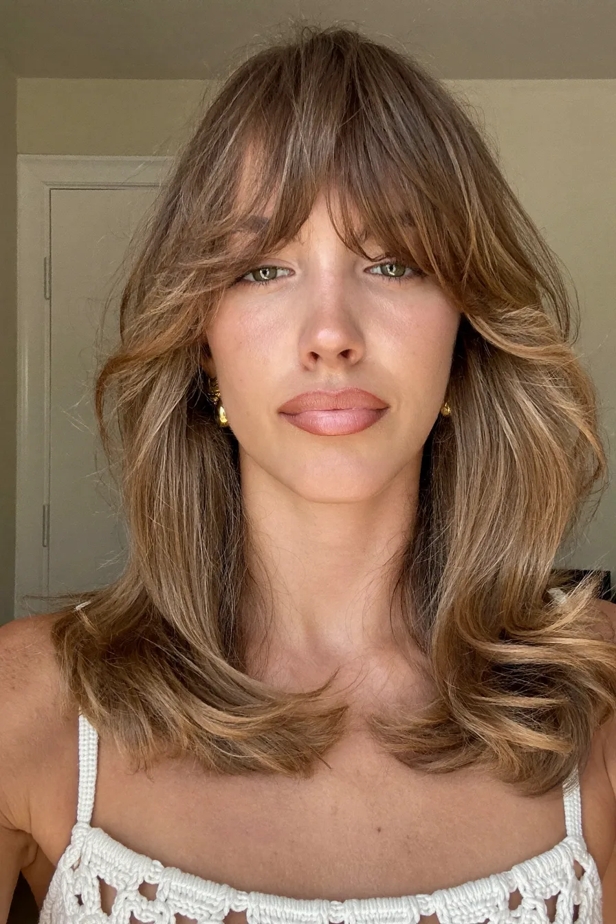 Effortless Medium-Length Shag with Soft Curtain Bangs Inspiration