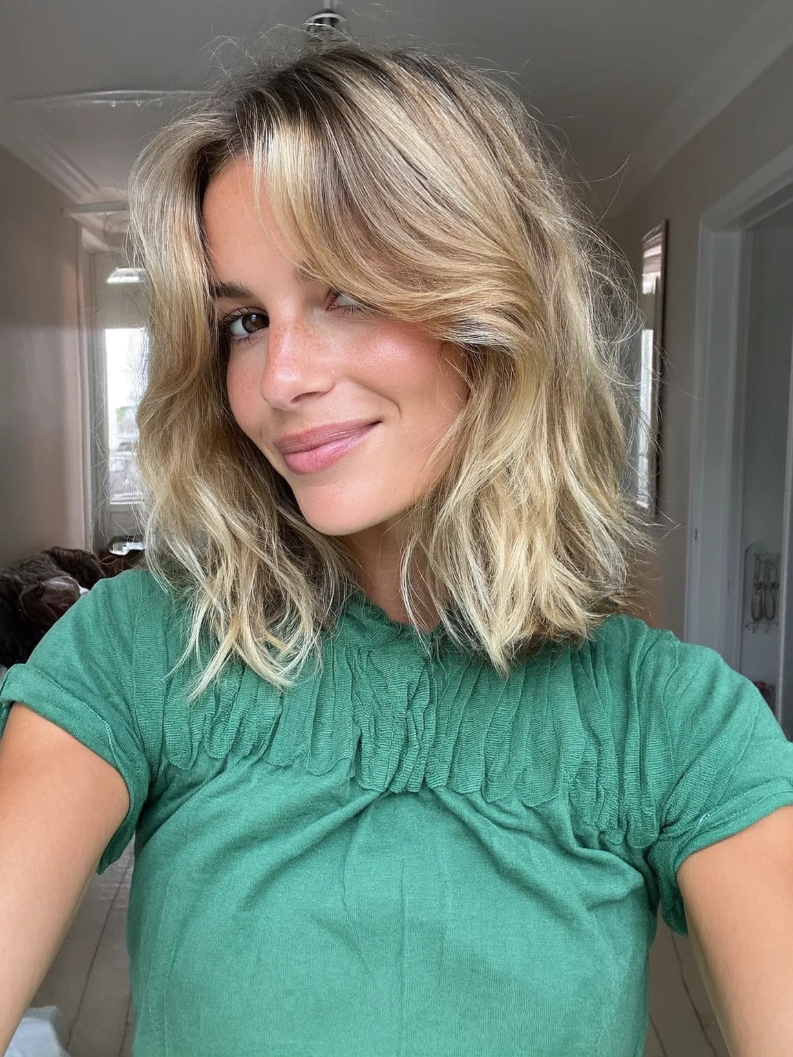 Sandy Blonde Wavy Lob with Curtain Bangs