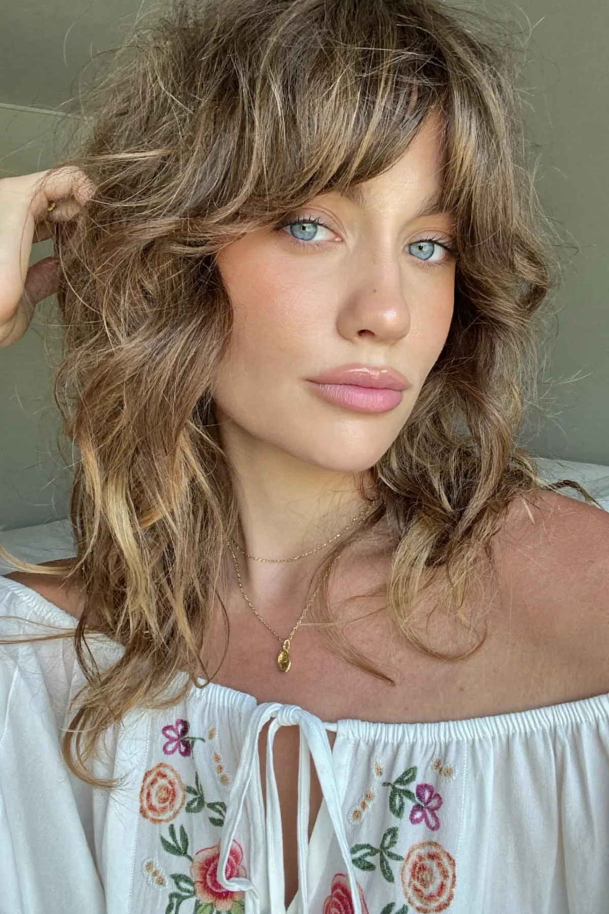 Caramel Bronde Balayage Shag with Wavy Curtain Bangs