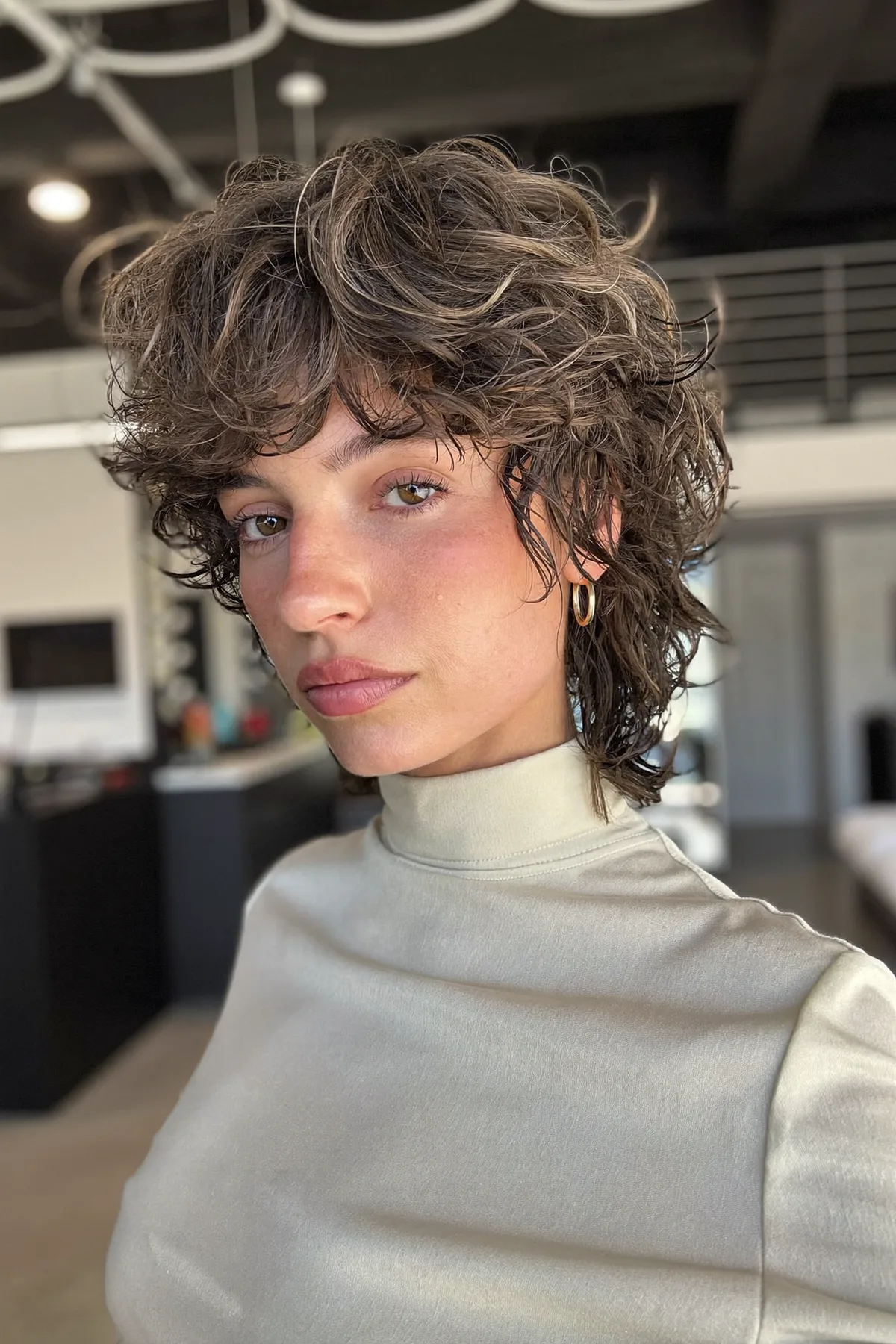 Natural Brunette Curly Shag with Curtain Bangs at Shoulder-Length