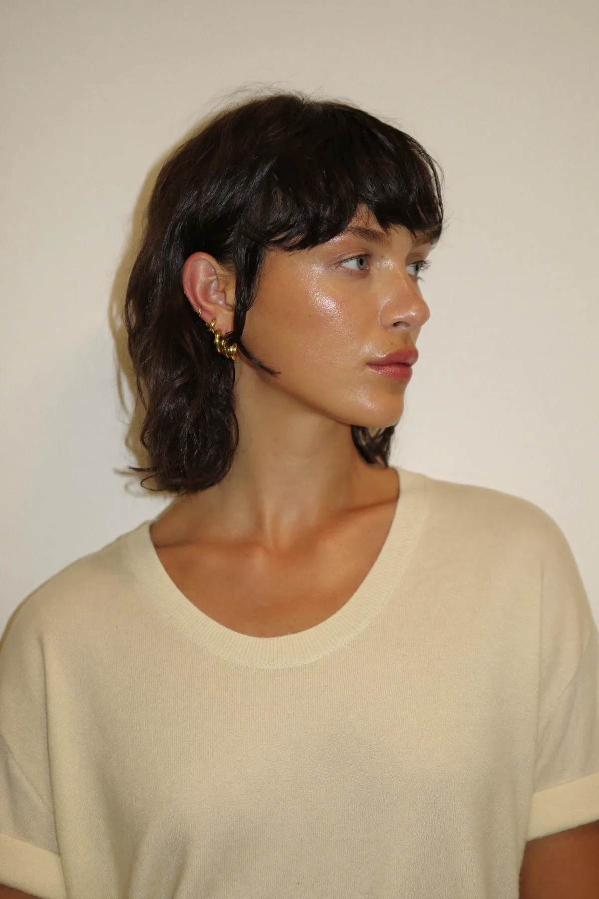 Collarbone-Length Natural Brunette Shag with Full Fringe Bangs