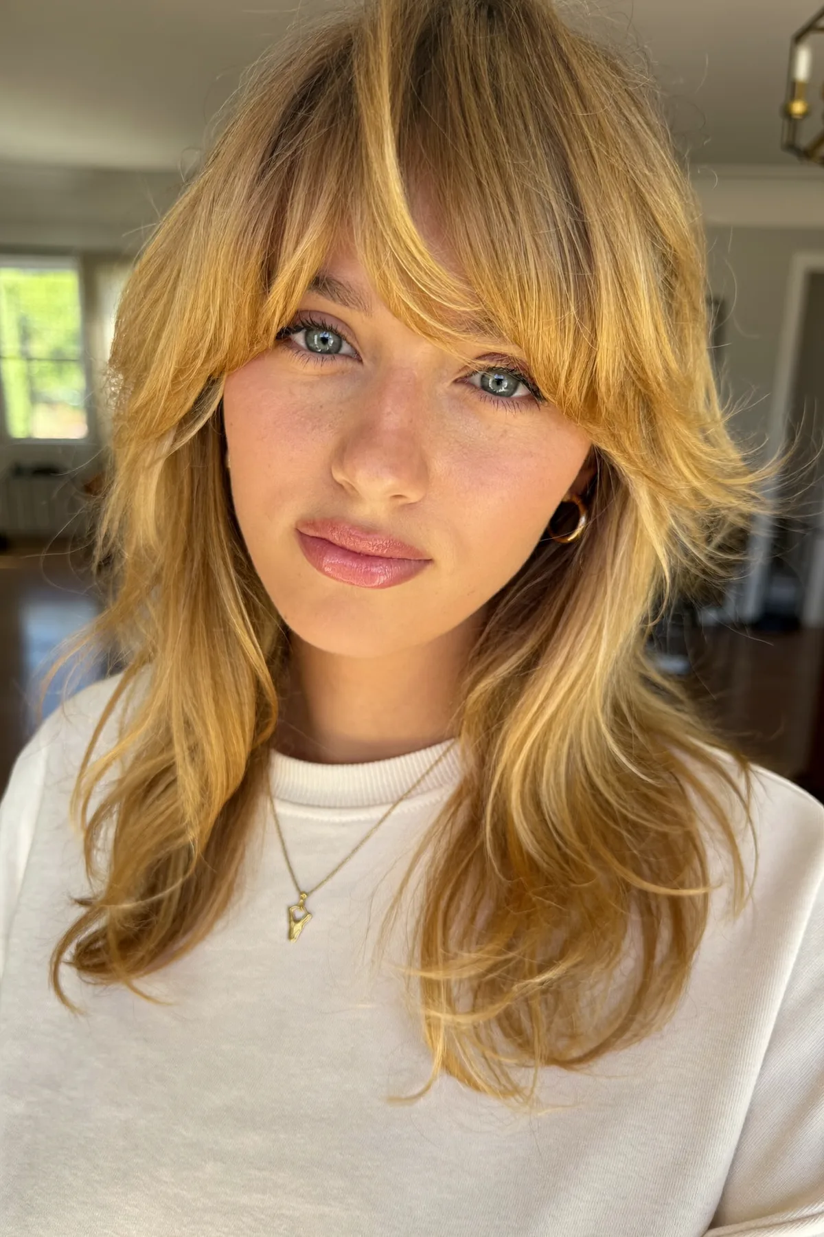 Collarbone-Length Honey Golden Blonde Shag with Curtain Bangs