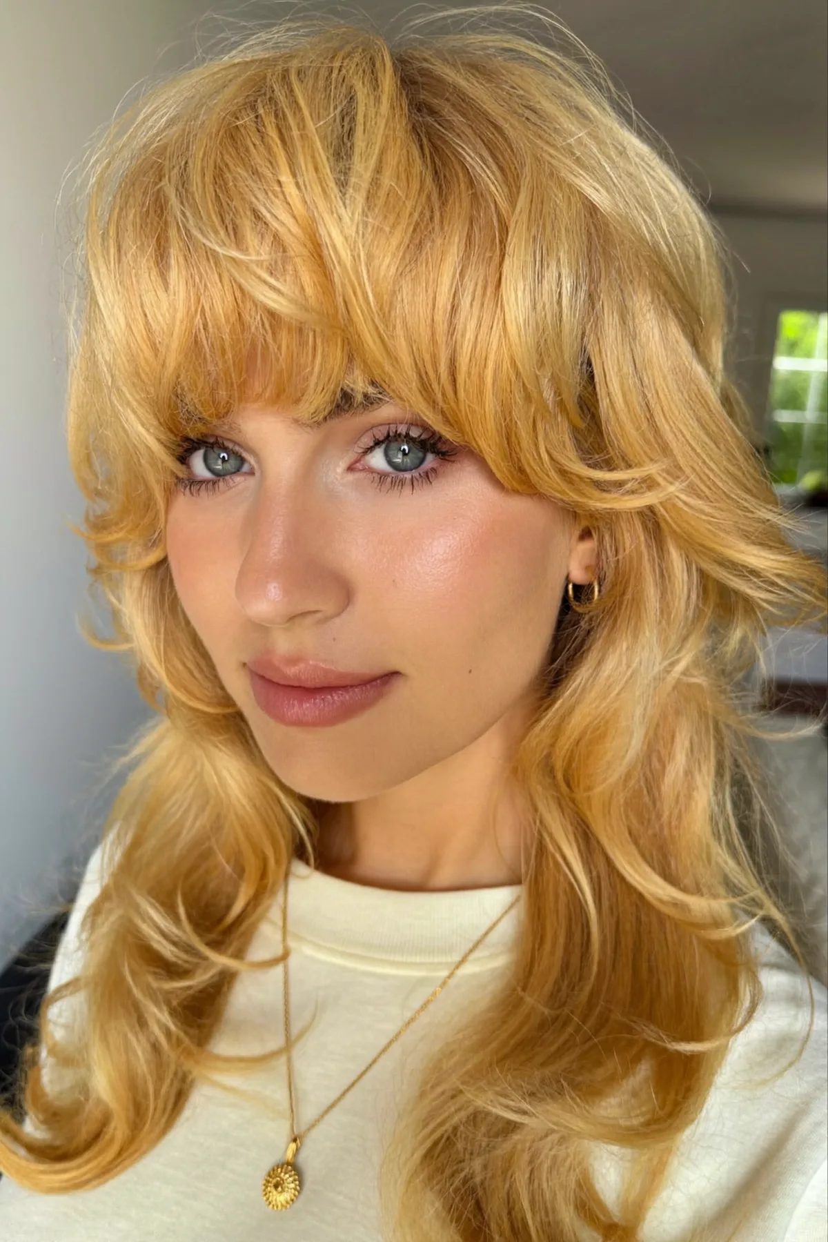 Honey Golden Blonde Collarbone-Length Shag with Curtain Bangs