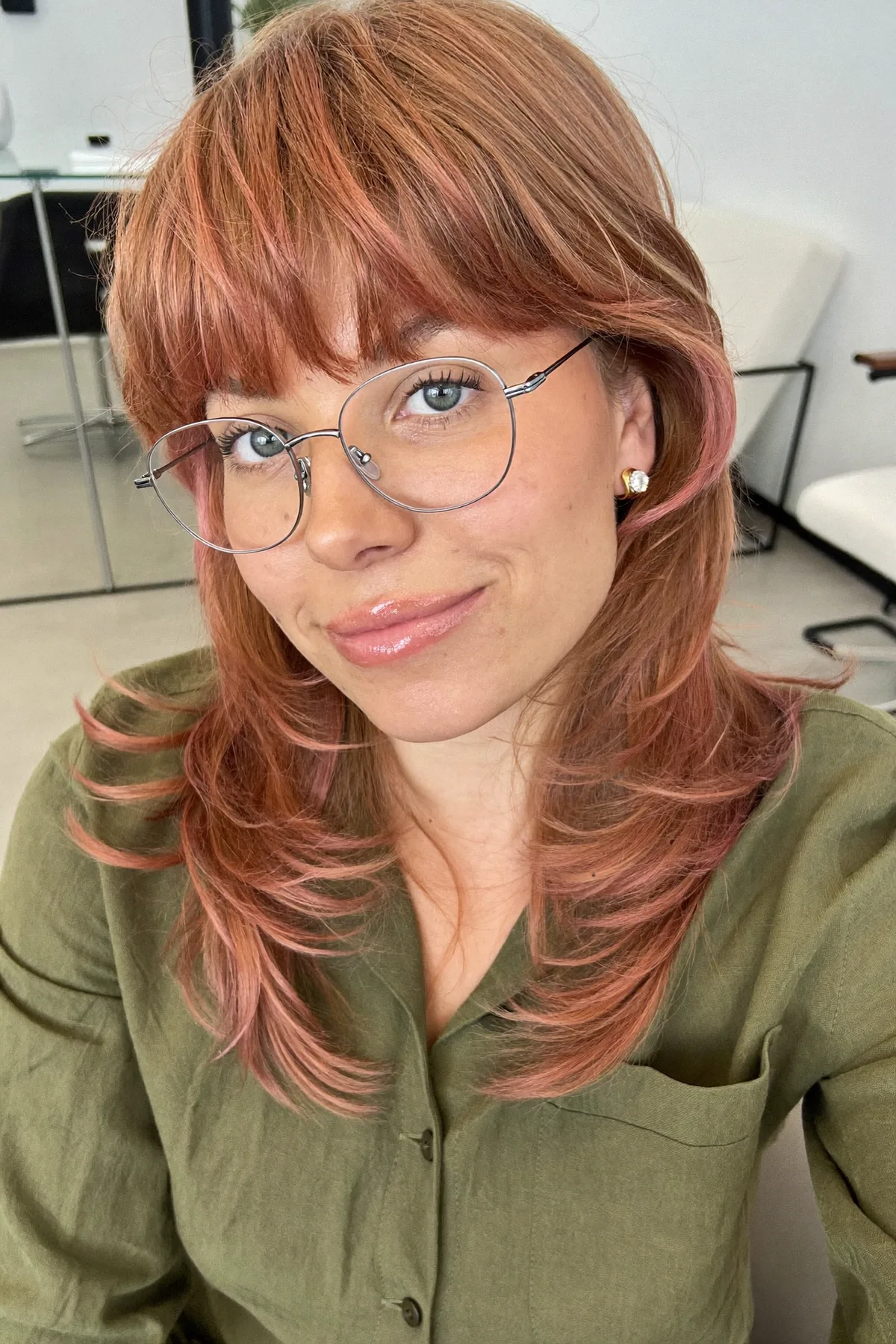 Collarbone-Length Strawberry Blonde Shag with Full Fringe Bangs