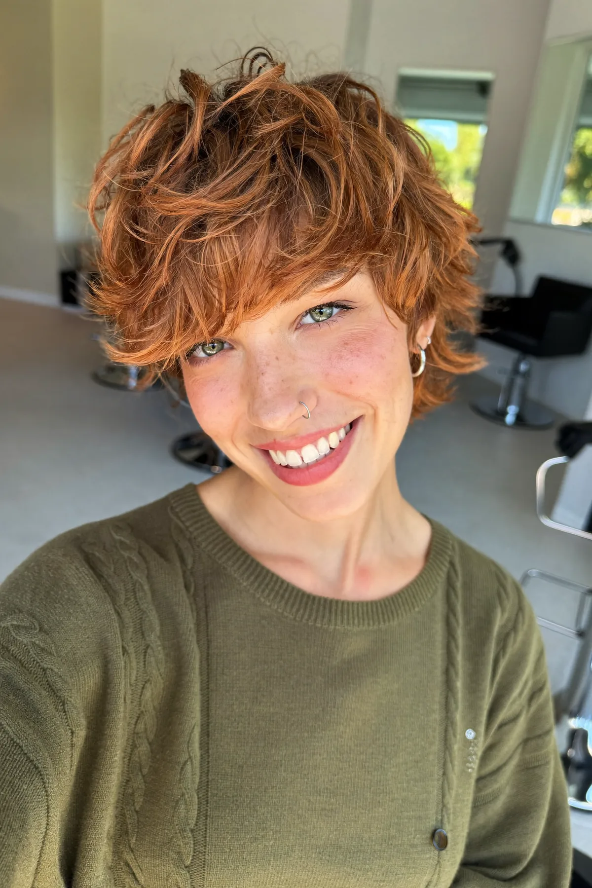 Wavy Copper Blonde Shag with Curtain Bangs for Effortless Volume