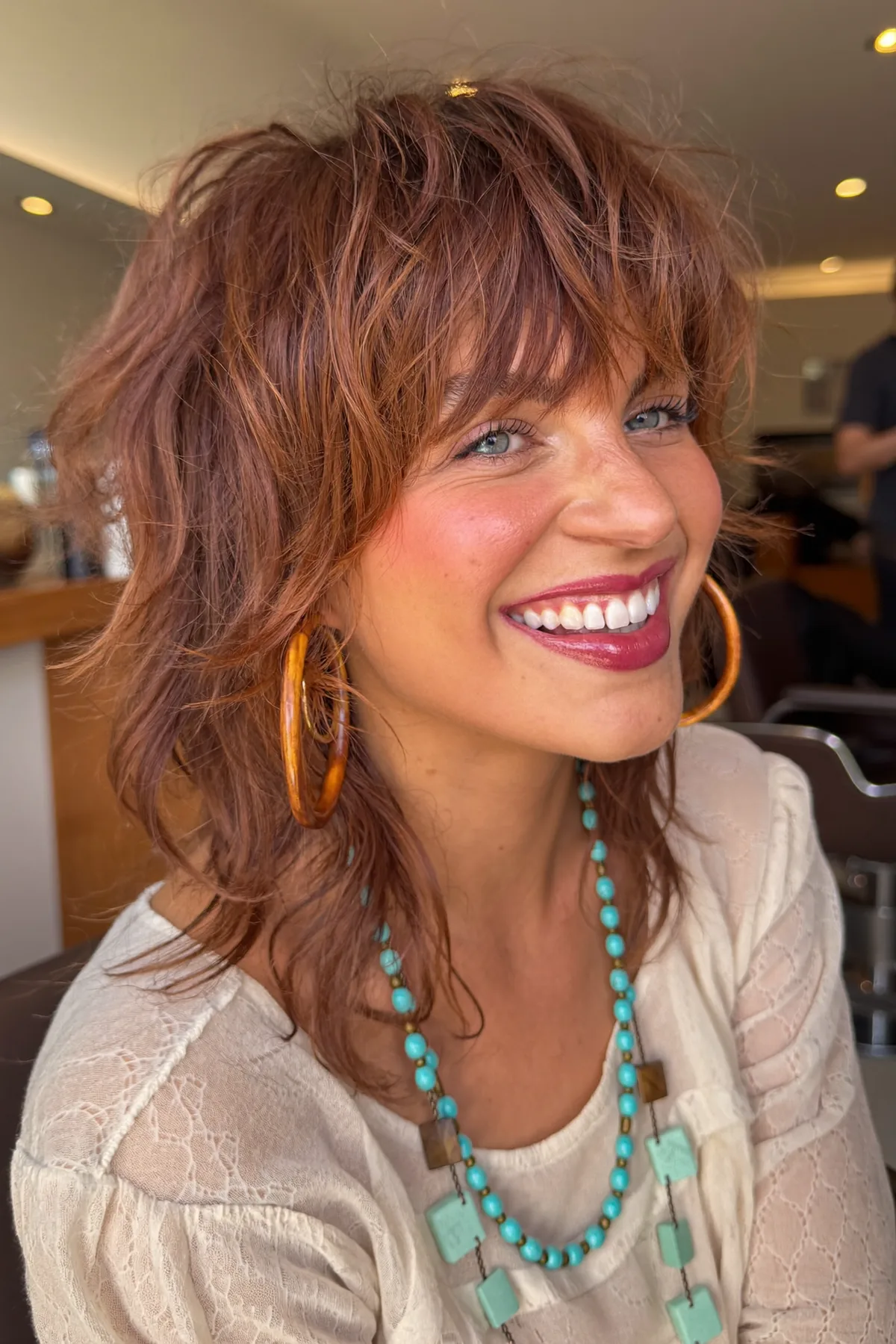 Collarbone-Length Auburn Copper Shag with Full Fringe Bangs