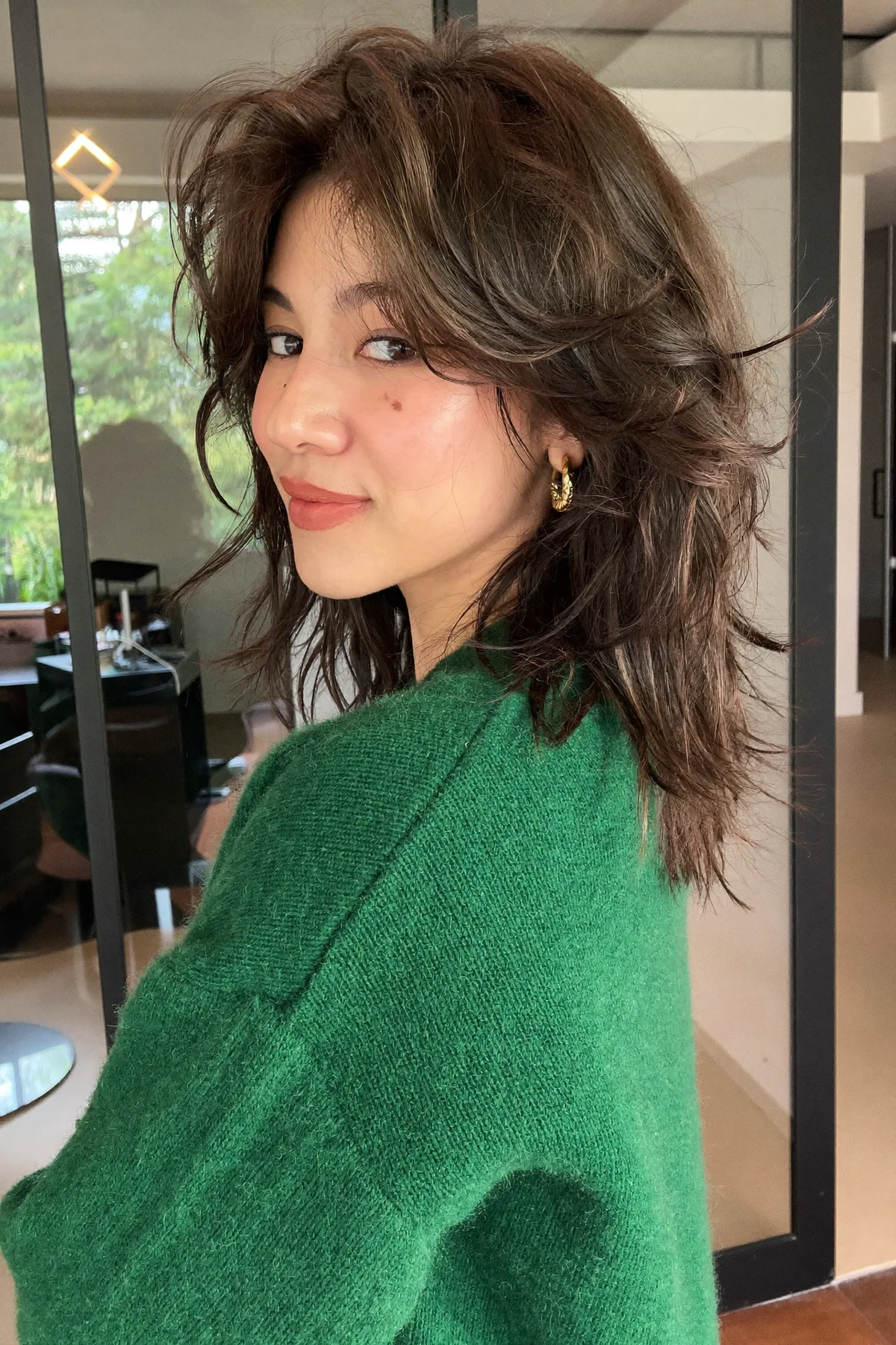 Collarbone-Length Natural Brunette Shag with Curtain Bangs