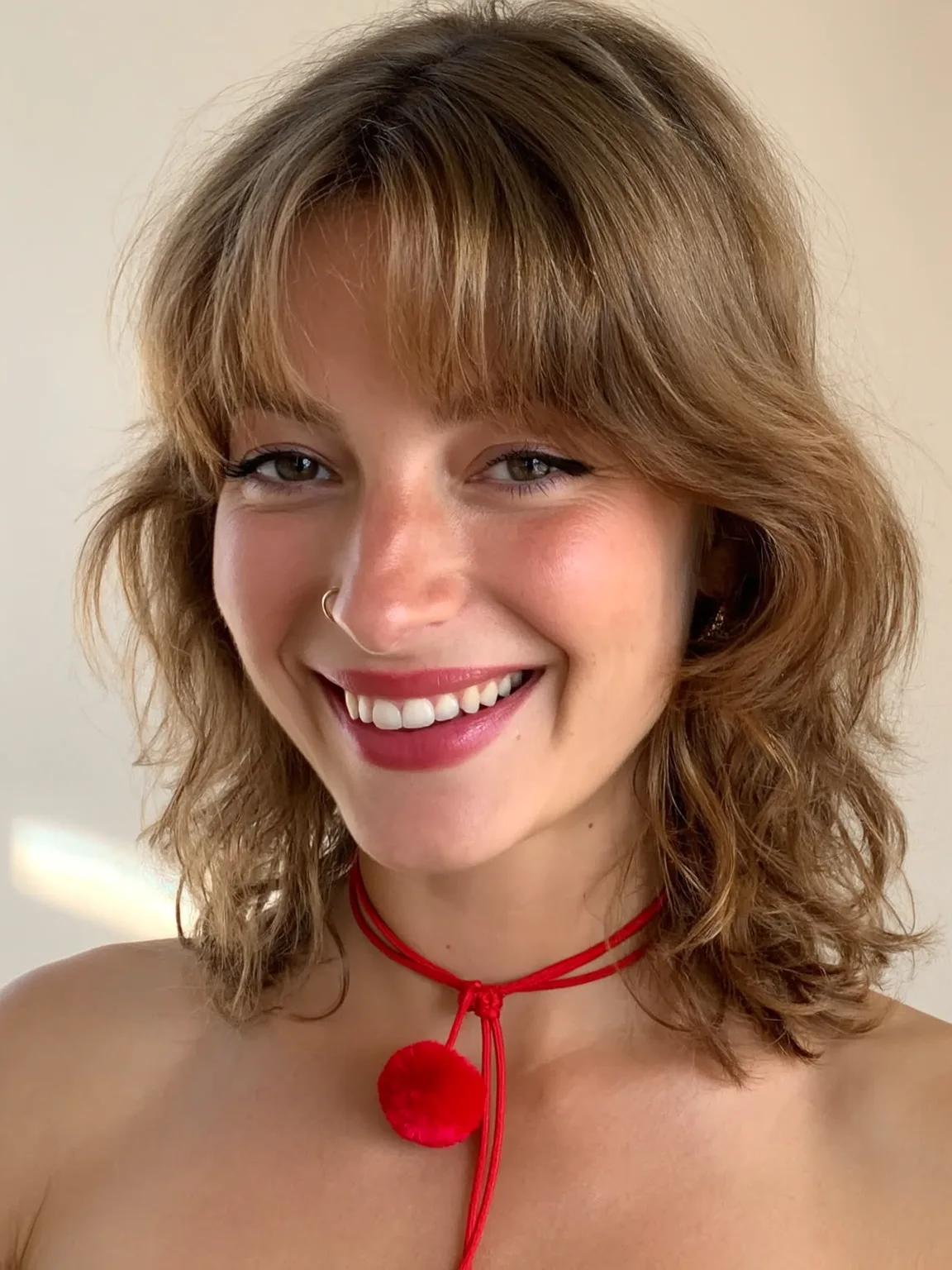Shoulder-Length Wavy Caramel Shag with Classic Curtain Bangs
