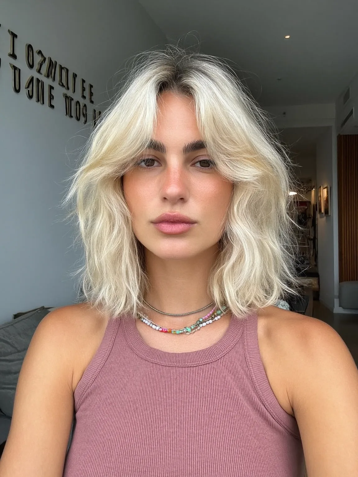 Chin-Length Platinum Blonde Shag with Curtain Bangs