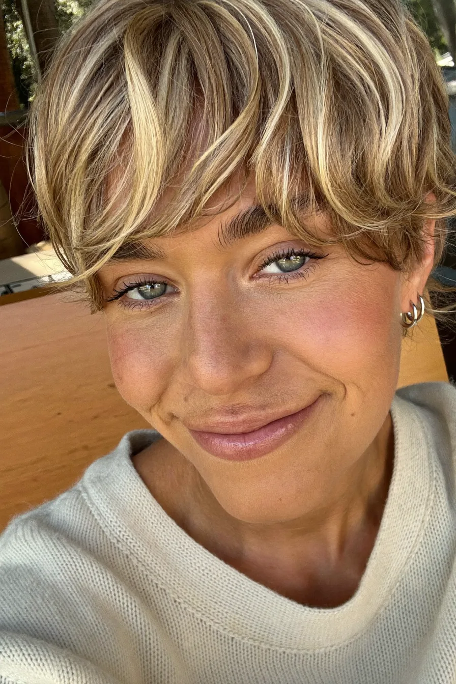 Textured Shaggy Bob with Soft Blonde Highlights and Wispy Bangs
